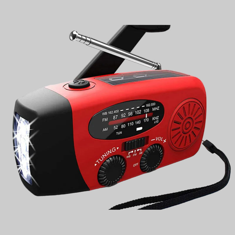 Red and black portable radio with flashlight on a white background